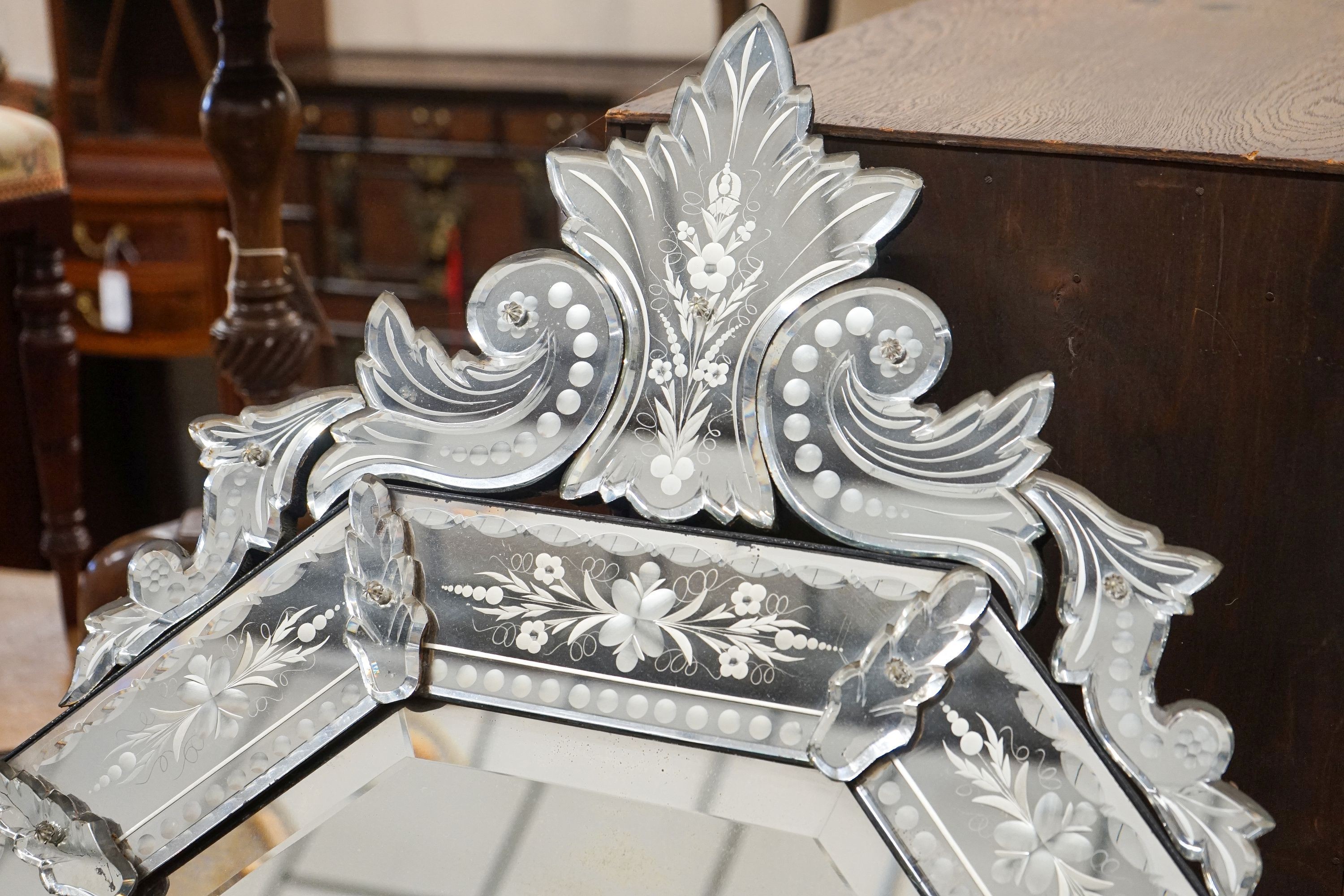 A Venetian style engraved octagonal wall mirror, width 60cm, height 108cm